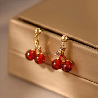 A Set of Three Stylish And Sexy Cherry Pendant Necklaces And Earrings