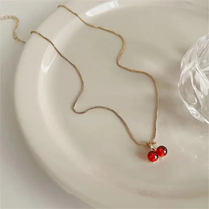 A Set of Three Stylish And Sexy Cherry Pendant Necklaces And Earrings